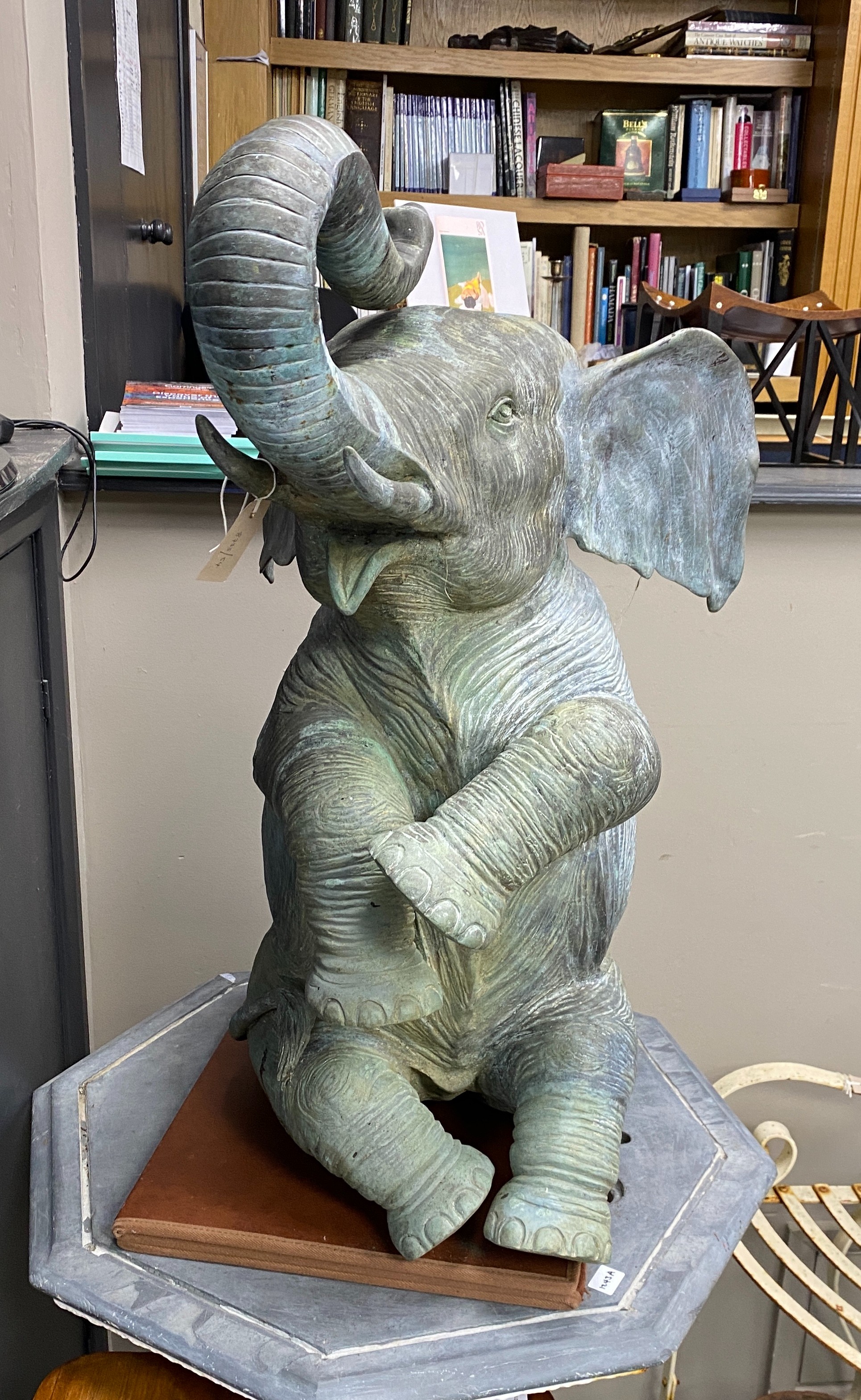 A bronze baby elephant garden fountain, height 87cm